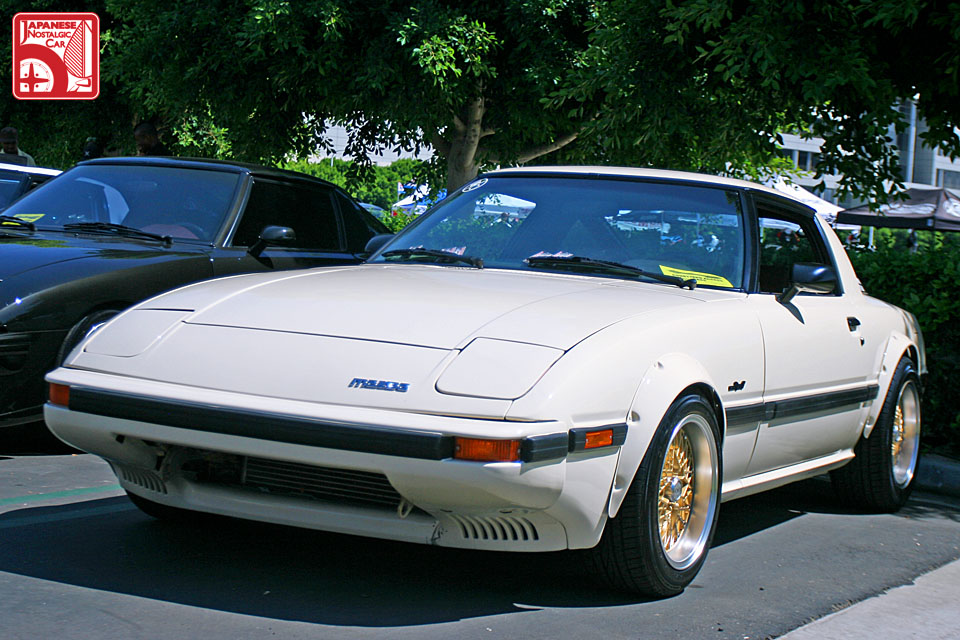 An exceptionally clean'84 RX7 coated in a nice cream color and wearing 