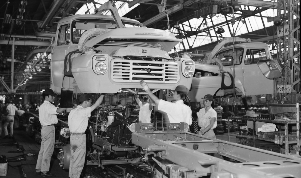 100 year club isuzu motors japanese nostalgic car works on an automobile assembly line